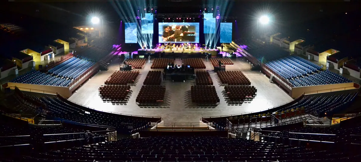 Arena stage with flown lighting and video